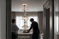 Team installing lighting fixtures in a luxury room